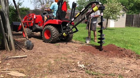 how to use a post hole digger compact tractor|compact tractor post hole auger.